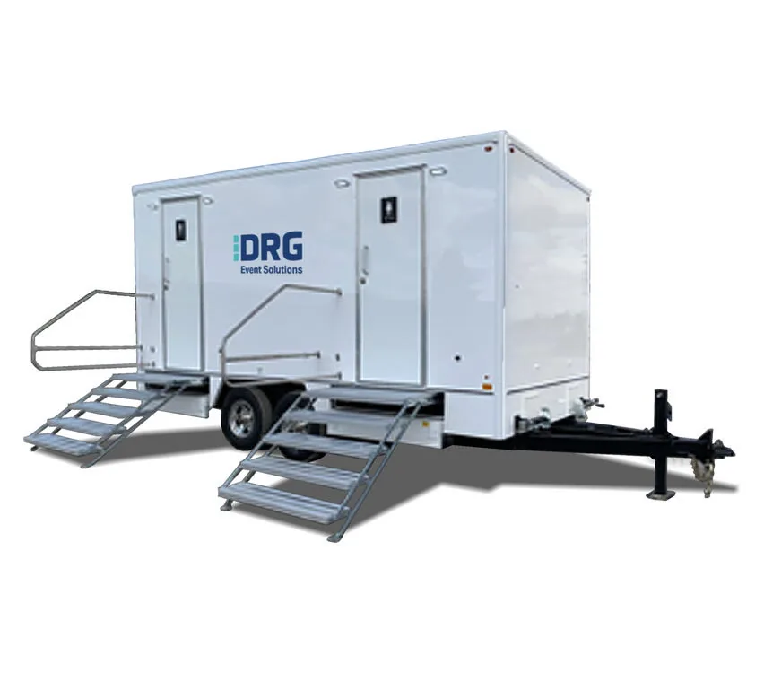 The 8-Stall Restroom Trailer with stairs and handrails at both doors.