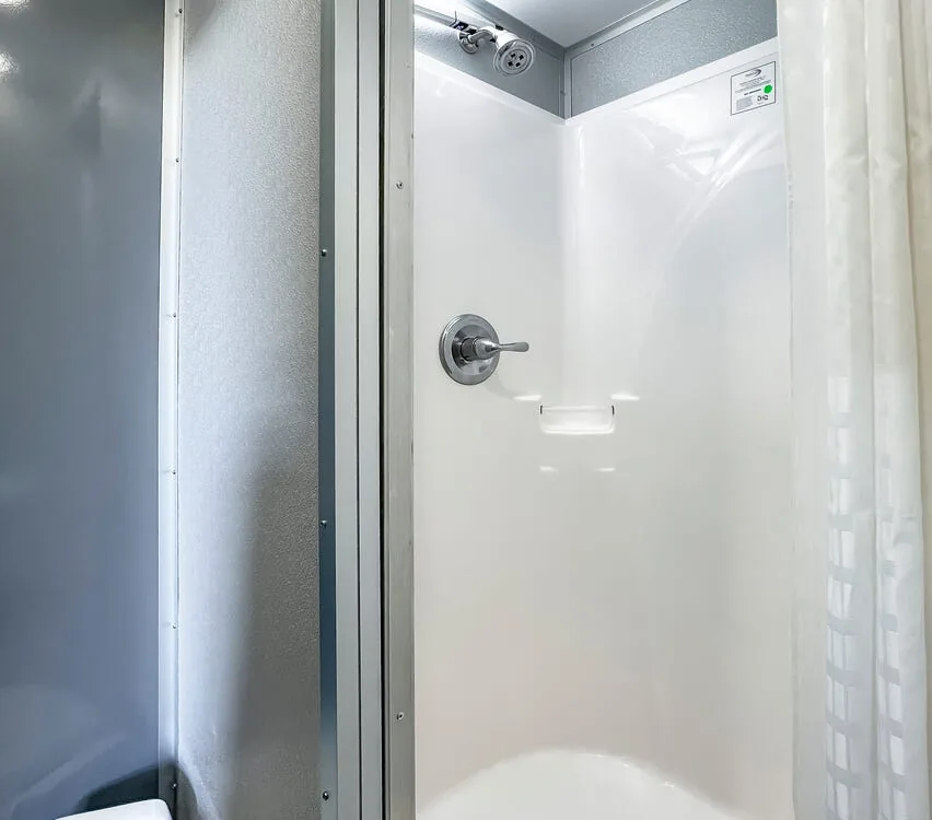 Shower stall inside a private suite.