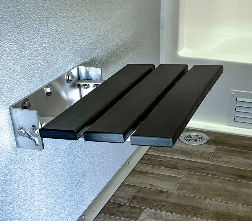 Fold-down dressing seat.