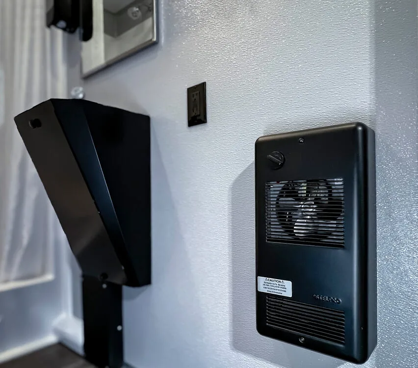 Paper towel dispenser and GFI outlet.