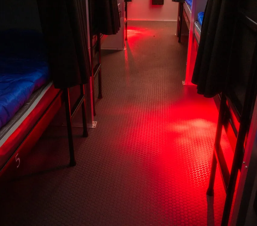 Red floor safety lighting in the aisle.