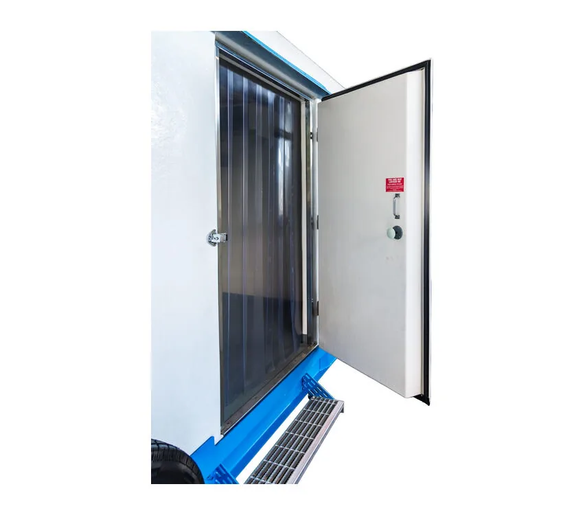 Open side loading door with strip curtains.