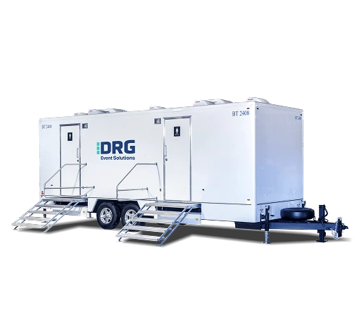 White DRG 10-stall restroom trailer with two sets of stairs.