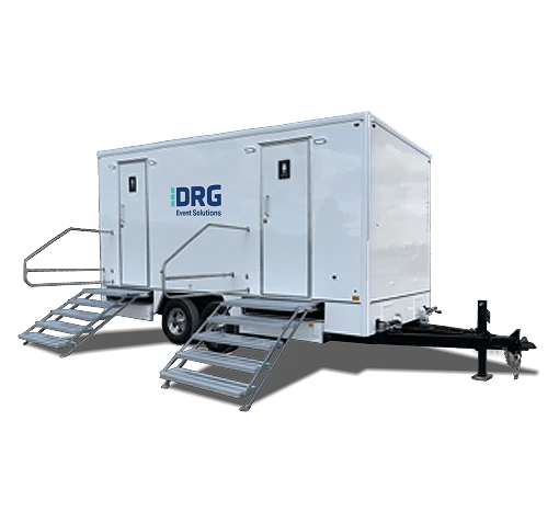 White DRG 8-stall restroom trailer with stairs and a railed landing.
