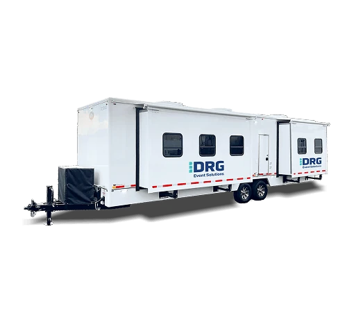 White DRG 32-foot command trailer with a slide out.