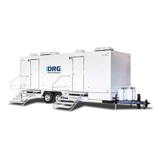 White DRG 8-set laundry trailer with two sets of stairs.