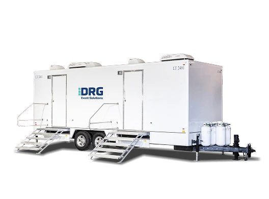 White DRG specialty trailer with two entry stairs.